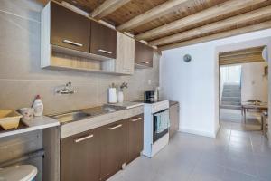 a kitchen with a sink and a counter top at Villa Sissy in Kerames