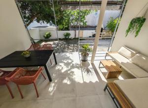 a patio with a table and chairs and a couch at Apartment Helena Rovanjska in Rovanjska
