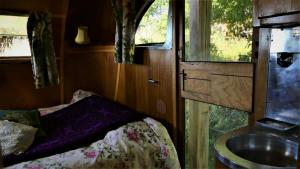 a small bathroom with a sink and a sink at Belrepayre Airstream Camp in Manses +88 photos