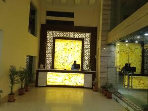a lobby with a large window in a building at Eden Resort By Live Inn in Lansdowne