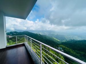 a balcony with a view of the mountains at Eden Resort By Live Inn in Lansdowne