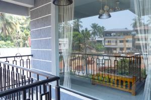 a balcony with a view of a building at Sukruthi service apartment 3BHK in Mangalore