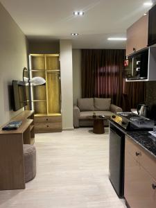 a kitchen and living room in a hotel room at Regal view Aparthotel in Cairo