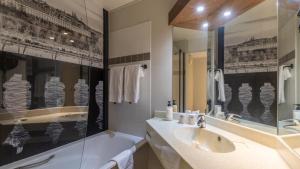 a bathroom with a sink and a mirror at Campanile PRIME - Le Blanc Mesnil in Le Blanc-Mesnil +34 photos