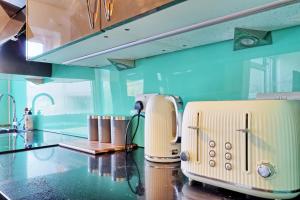 a toaster sitting on a counter in a kitchen at 1 bed, office space, private parking, contractors in Chelmsford