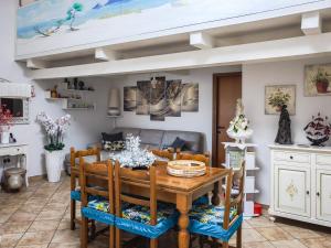 a dining room with a table and chairs at Magic DaLu House in Olbia