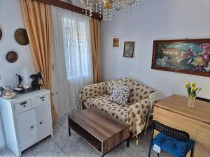 a living room with a couch and a table at Dimitra House in Parga