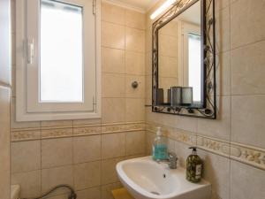 a bathroom with a sink and a mirror at Corfu Green Escape in Achílleion