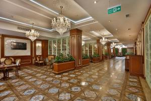 a lobby of a hotel with chandeliers at Alermo Hotel-SPA in Baku +143 photos