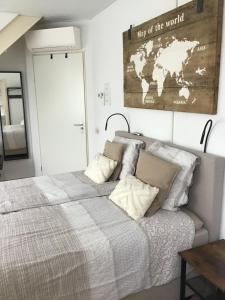 a bedroom with a bed with a map on the wall at B&B Knooppunt70 in Arcen +42 photos