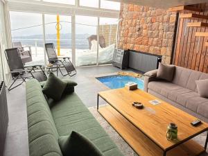 a living room with a couch and a table at O Sommet in Zaarour