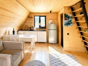 a kitchen and living room in a log cabin at Achkhoti Paradise in Kazbegi