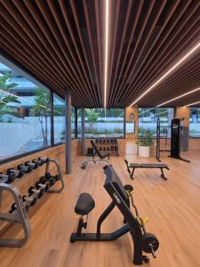a gym with treadmills and exercise equipment in a building at Flamenca Village Apartment SALSA in Orihuela Costa