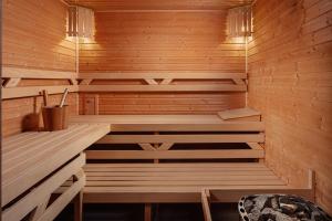 a sauna with wooden walls and wooden floors at Zámecký Hotel Litomyšl in Litomyšl
