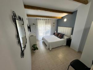 a bedroom with a bed in a room at Casa Atalaya Playa R&R in Aguadulce