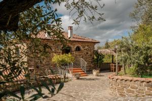 a stone house with a staircase in front of it at Villa Nigro in Laureana Cilento