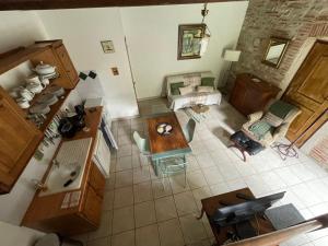 an overhead view of a kitchen and a living room at Manoir La Bordeneuve in Villeneuve-sur-Lot