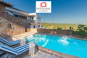 a swimming pool in a villa with a view at Casa Serena in Vall-Llobrega