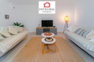 a living room with two couches and a coffee table at Casa Serena in Vall-Llobrega