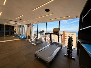 an office with a gym with a view at Emunah Flat Luxo Cabedelo • Piscina no Rooftop in Cabedelo