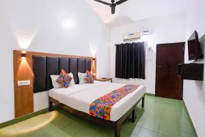 a bedroom with a large bed in a room at Via Romeo's Stay - A Beach Property in Baga