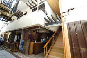 a building with a staircase leading up to a restaurant at Taj Resort and Spa in Boracay