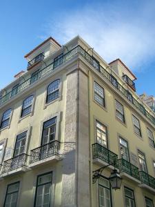 a large building with balconies on top of it at LSA Baixa Chiado by Numa in Lisbon