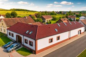 an overhead view of a house with cars parked in front at Centrum Rosenbaum in Beroun