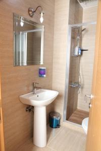 a bathroom with a sink and a shower at garden hill hotel in Istanbul