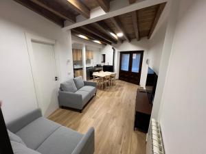 a living room with two couches and a table at Raíces in La Alberca