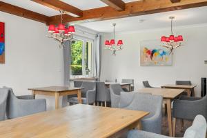 a dining room with wooden tables and chairs at Chalet Bodenschatz in Vandans