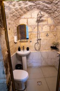 a bathroom with a sink and a toilet and a shower at sermest house in Urfa +34 photos