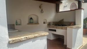 a kitchen with a stone counter and a stove at Addaura Paradise House in Palermo