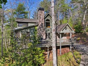 a house with a wrap around porch in the woods at Not Your Average Bear Hot Tub in Blue Ridge