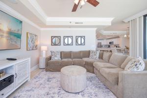 a living room with a couch and a table at Phoenix IX 707 in Orange Beach
