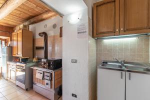a kitchen with a sink and a stove at Private Green Oasis - Terrace - Happy Rentals in Tenno