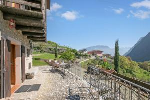 a balcony with a view of a mountain at Private Green Oasis - Terrace - Happy Rentals in Tenno +24 photos