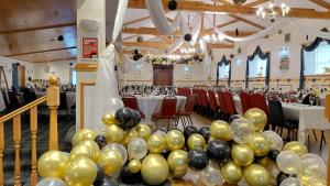 a banquet hall with balloons and tables and chairs at The Portland Hotel in Lybster