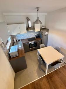 an overhead view of a kitchen with a table and chairs at Marija in Posedarje