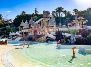a water park with people playing in the water at Ocean Paradise View in Adeje