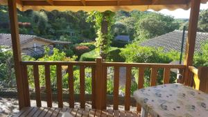 a balcony with a view of a garden at Mobilhome Rico in Gassin