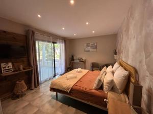 a bedroom with a large bed and a balcony at Résidence Alba in Bonifacio +74 photos
