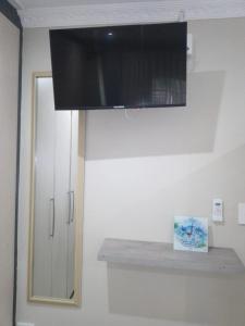 a kitchen with a black microwave above a counter at Nolangeni Lodge in Margate