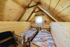 an overhead view of a bedroom in a log cabin at Vikendica,Bungalovi Lipska pećina in Cetinje