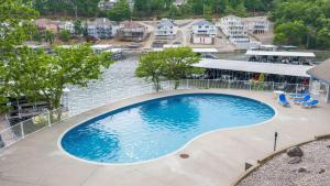 an overhead view of a large swimming pool at By The Lake Resort Access in Lake Ozark