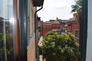 a view from a window of a city street at Il Loft Arona Centro, Le Dimore del Corso in Arona