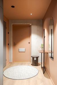 a hallway with a door and a table at Aarni Property in Jyväskylä +43 photos