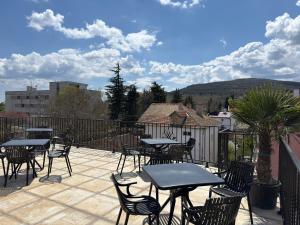 a group of tables and chairs on a patio at Relax Boutique House in Kranevo