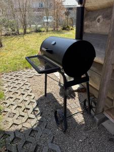 a grill sitting on top of a patio at Chalet 4 in Sankt Englmar
