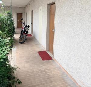 a motorcycle parked in a hallway of a building at Hotel Moderno in Tavagnacco